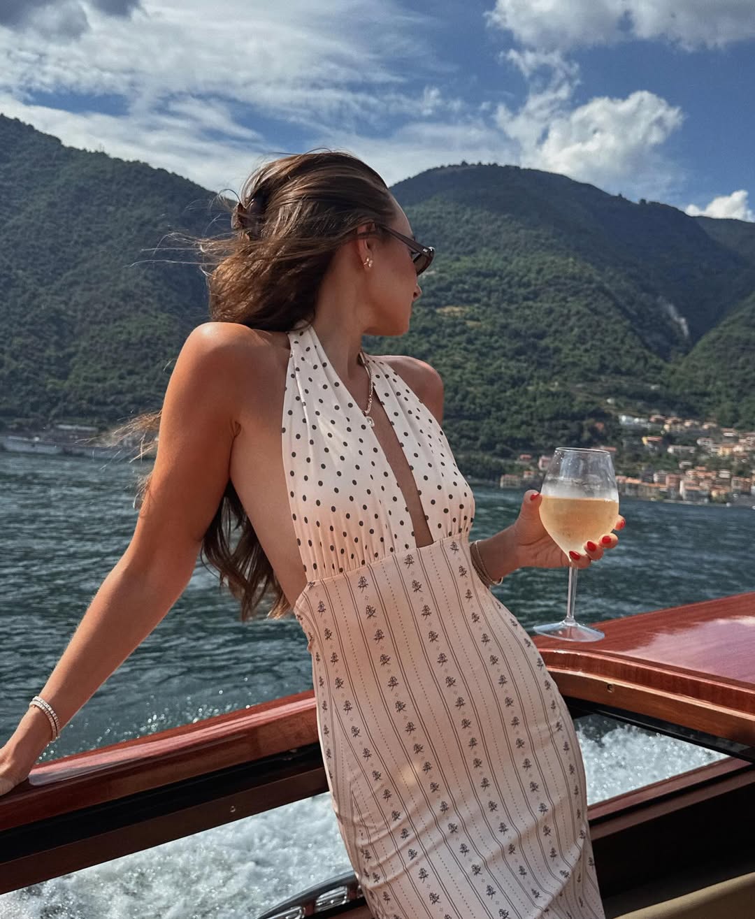 Danielle Bernstein on boat with wine