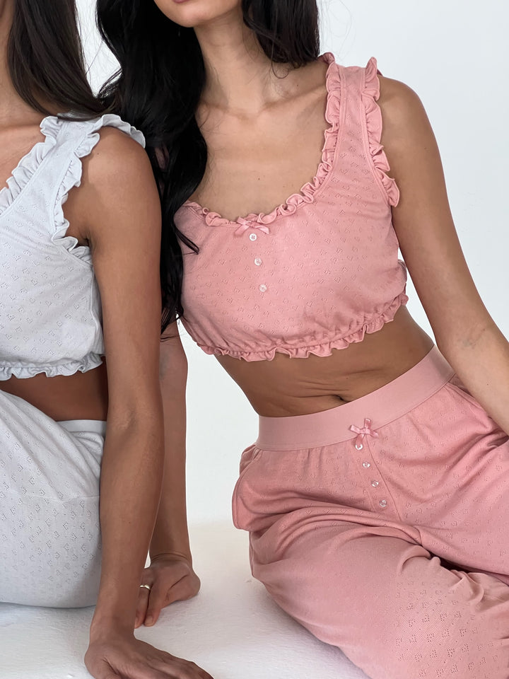 WeWoreWhat Spring 2024 Intimates collection matching buttery pointelle sets in white and pink