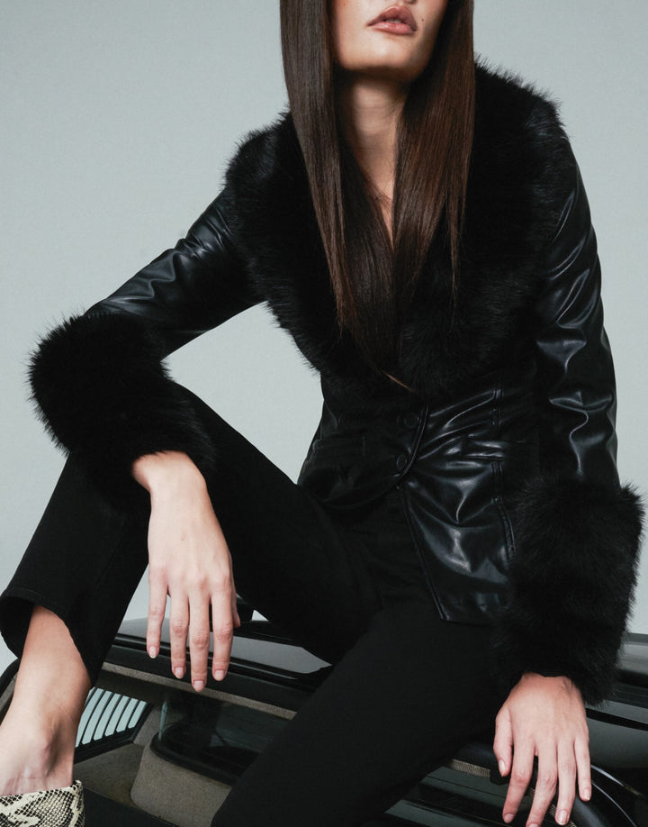 Model wearing WeWoreWhat Vegan Leather fur trim jacket